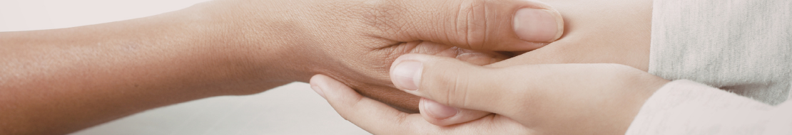 Two hands holding in a supportivve way.